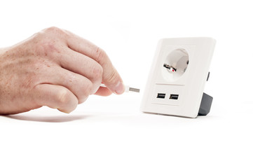 Plug in. A man stabs a usb plug into a usb port