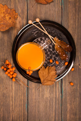 Hot sea-buckthorn drink. Toned image. Selective focus