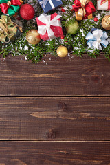 Fototapeta na wymiar Christmas decorations on wooden board background with copy space