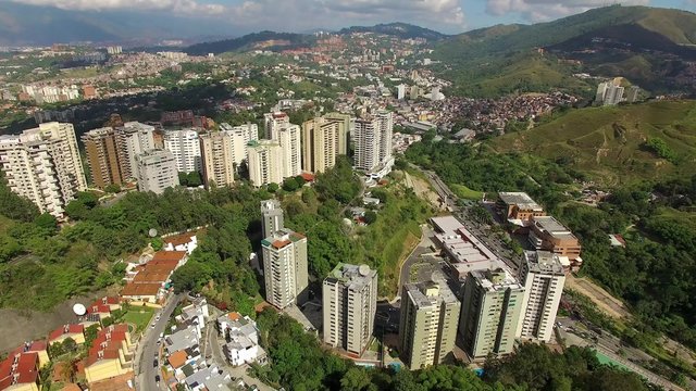 Aerial view of a residential district overflight on a capital city: Caracas city Valley.  Caracas is the capital, the center of the Greater Caracas Area.
