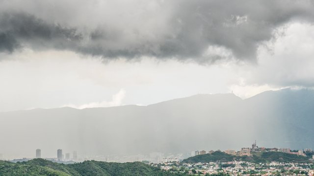 Time lapse of a stormy weather over tropical capital city. Rain and clouds fast moving in time lapse. HD 1080. Caracas is the capital, the center of the Greater Caracas Area.