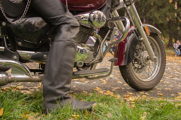 Naklejka premium biker boots in black on a motorcycle