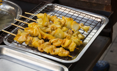 Product of squid on tray in market prepared to grill
