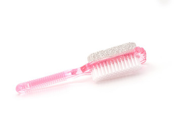 Brush and pumice stone for foot care isolated on white backgroun