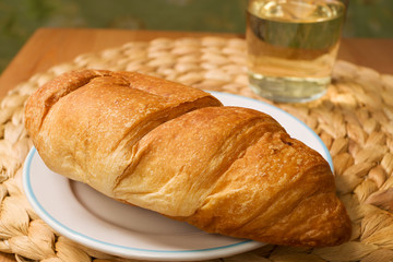 Croissant with drink on the table