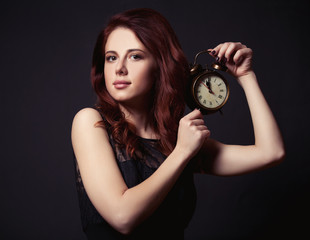 Woman with vintage alarm clock