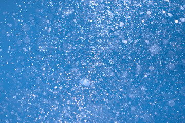 Fototapeta premium spray water on a blue background