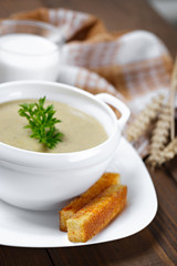 Vegetable soup with parsley and fried bread.