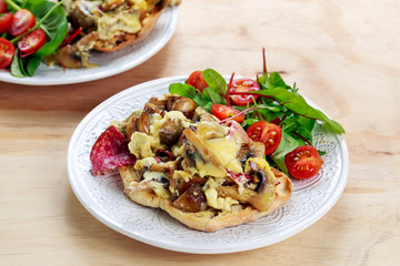Rustic Morning Breakfast, toast with mushrooms, cheese omelette and fresh vegetables