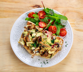 Rustic Morning Breakfast, toast with mushrooms, cheese omelette and fresh vegetables