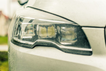 Close up car lights. Rainy weather.