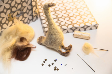 Felting. Handmade felted toy. Wool for felting with tools