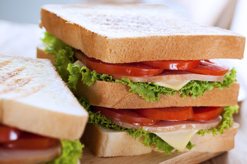 sandwiches put on wooden board for breakfast