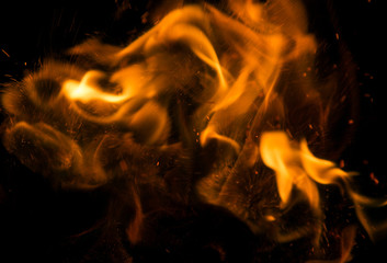 Fire flames on a black background with sparks
