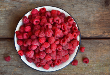 Raspberries on a wooden background