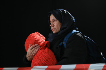 Woman posing with things as refugee