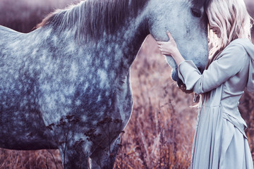  beauty blondie with horse in the field,  effect of toning