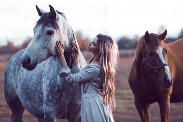  beauty blondie with horse in the field,  effect of toning