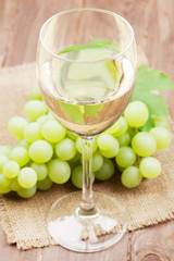 White wine glass and grapes