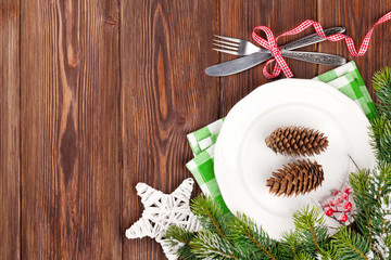 Fototapeta na wymiar Christmas table setting with fir tree