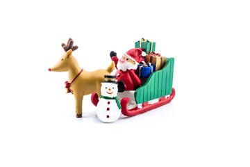 Santa claus in sleigh carrying a gifts with reindeer and snowman