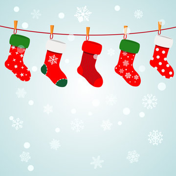 Christmas background with socks hanging on a rope