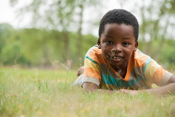 African boy in the grass
