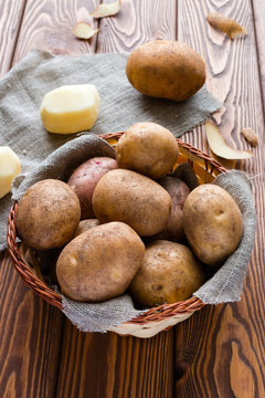 basket of crude potatoes on a gray napkin
