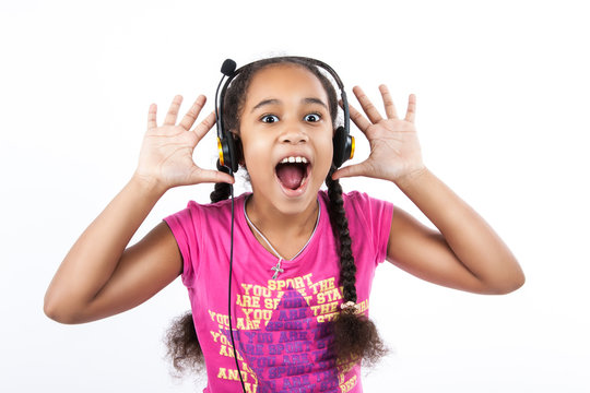 Little dark-skinned girl in headphones