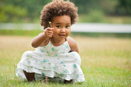African girl with a flower