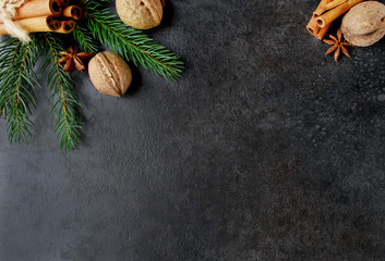 Background with cinnamon, walnuts and spruce