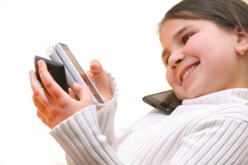 Little girl talking on mobile smartphone