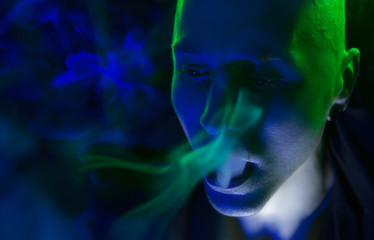 Club Party – Nightlife. Handsome Sexy Young Stylish Man Smokin