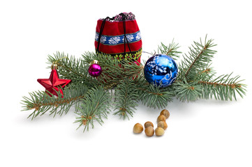 red bag with gifts, a fir-tree branch and hazelnuts