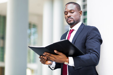 Fototapeta premium African businessman looking his agenda