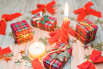 Christmas gift boxes with red ribbons and gold stars
