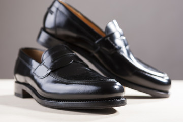 Fototapeta na wymiar Footwear Concepts. Pair of Stylish Fashionable Real Leather Black Penny Loafers