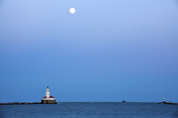 Full Moon rising above Lake Michigan and Chicago Lighthouse