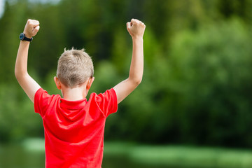 Boy with raised arms