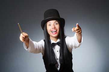 Woman magician in funny concept