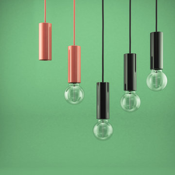 Decorative antique light bulbs against green background