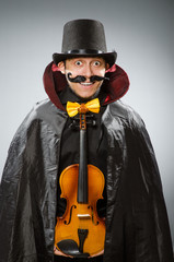 Funny violin player wearing tophat