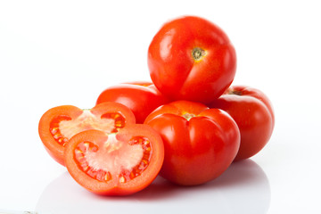 Fresh tomatoes isolated on white.