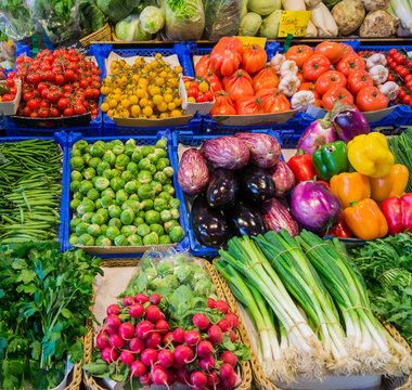 market with various colorful fresh fruits and vegetables. Farmer