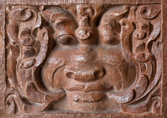 Textured face on bas-relief of historical Hindu temple