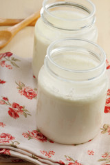 Two jars of yogurt