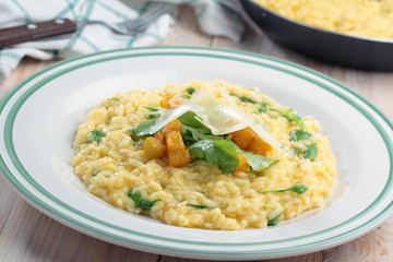 Pumpkin risotto with arugula and Parmesan cheese