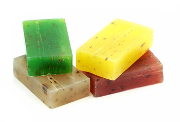 Colorful natural herbal soaps isolated on white background.
