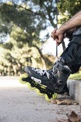 Urban young man roller sitting on the floor. Roller Concept