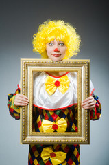 Clown in funny concept on dark background